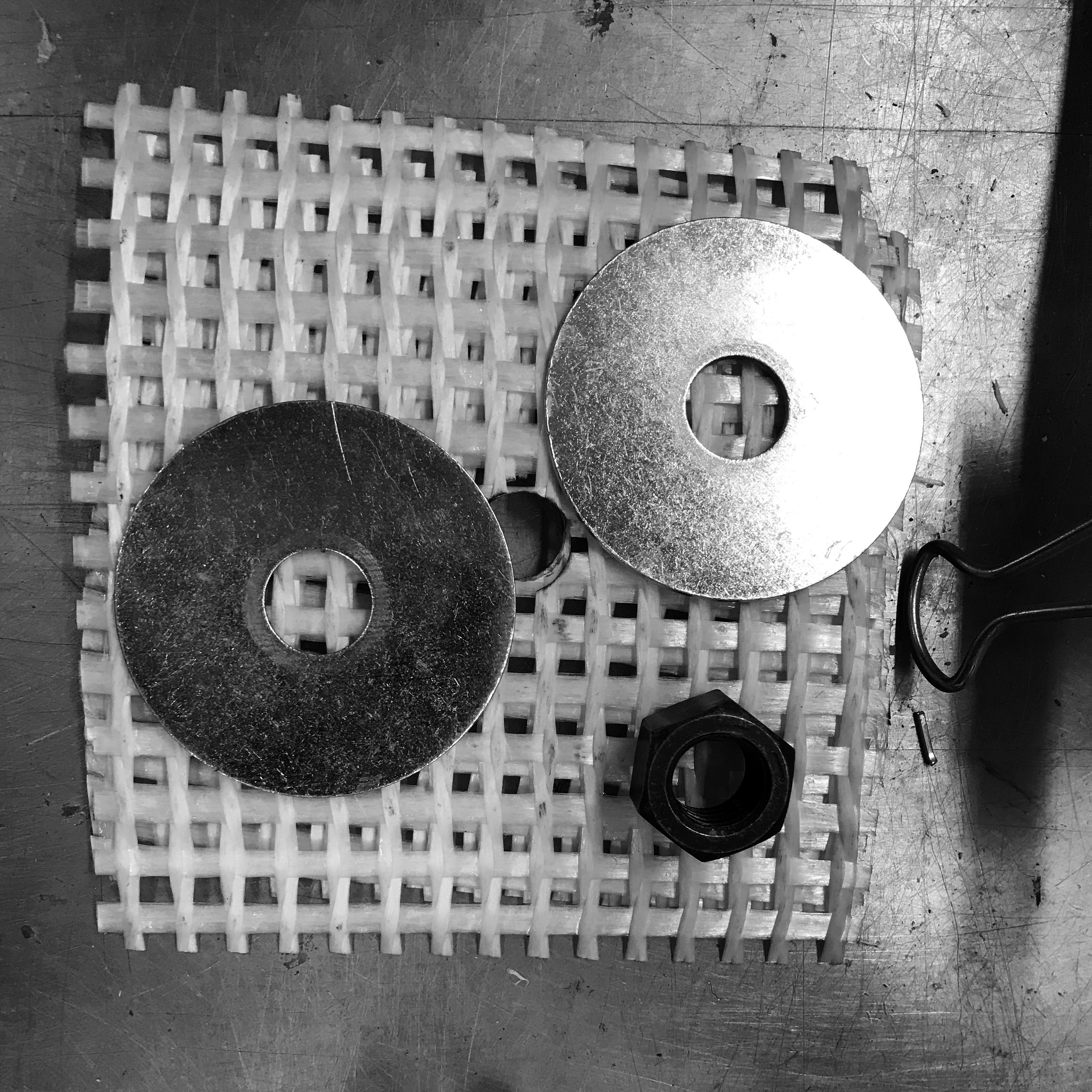 Two washers and a nut were embedded in the concrete for flexible attachment to the backplate.