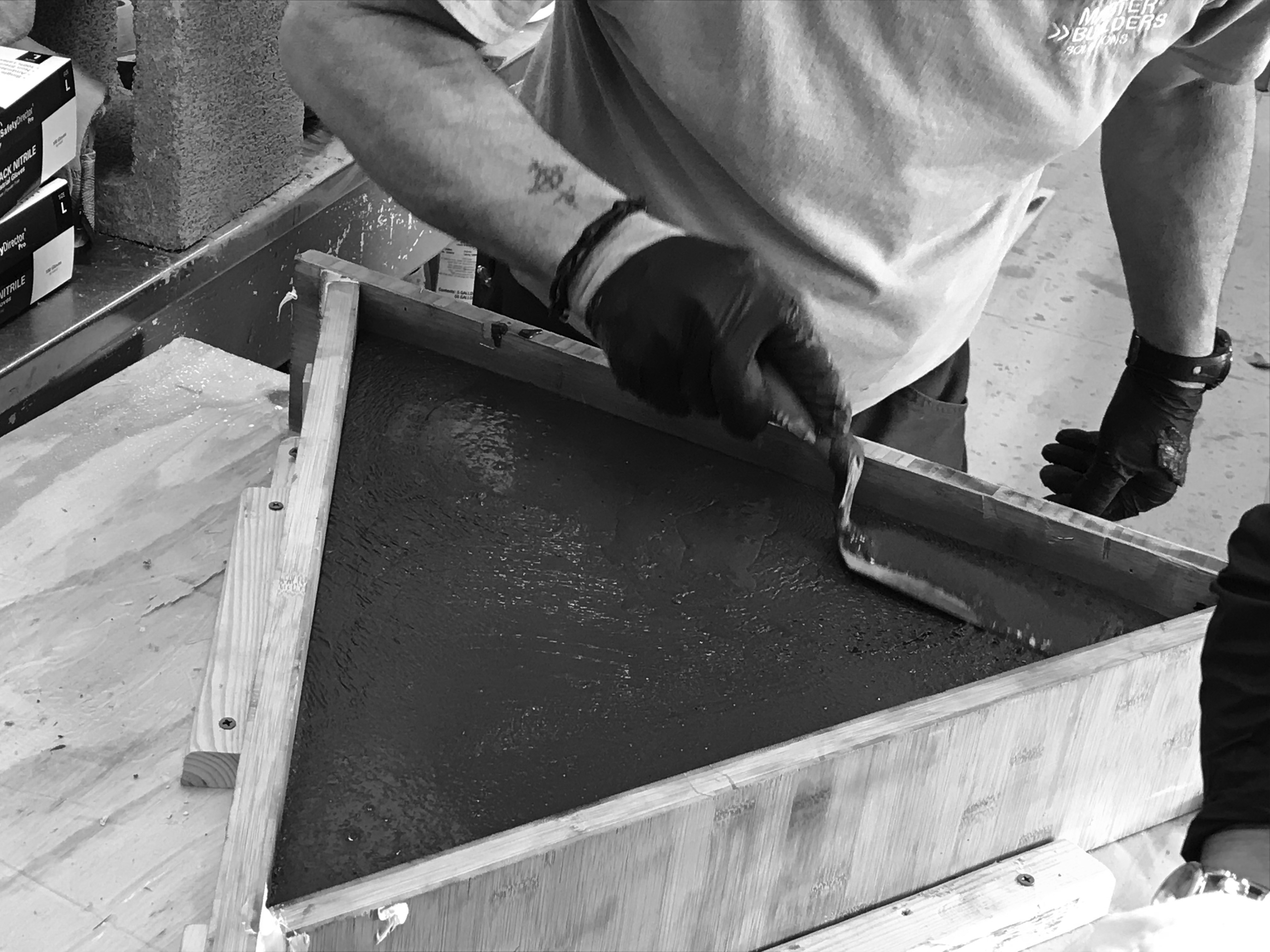 Leveling of the concrete for backplate compatibility.